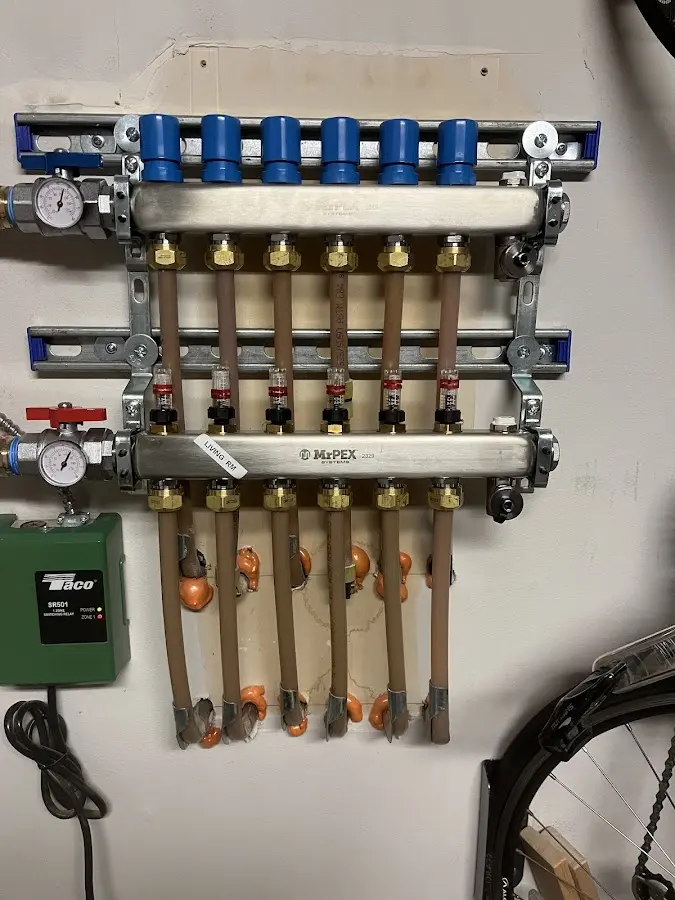 Plumber performing Water Heater Repair at a residential property in Woodburn